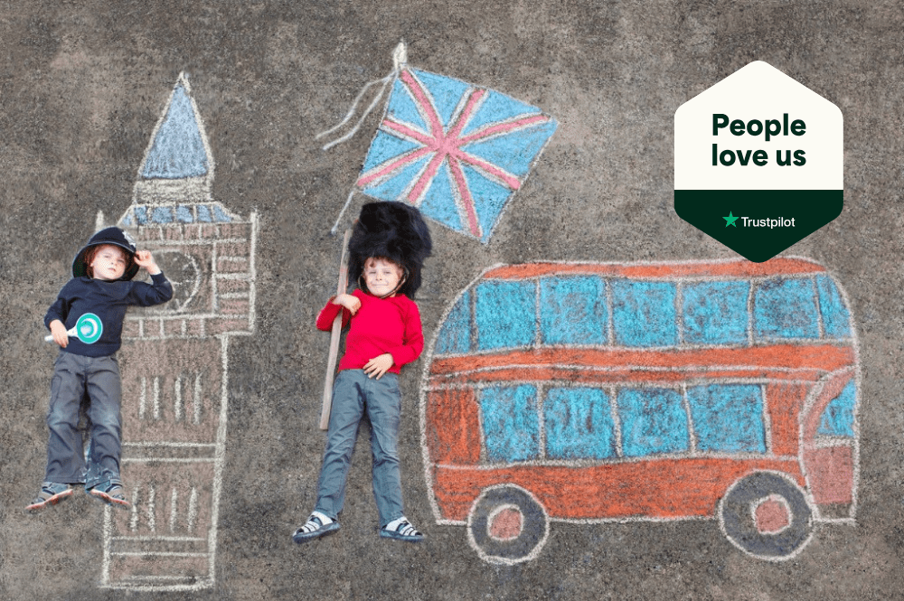 Kids laying on a chalk drawing of Big Ben and a red double-decker bus